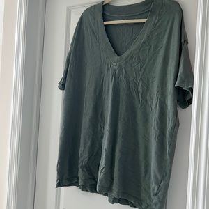 Worn a couple times. Fits like an xl. Muted green in color